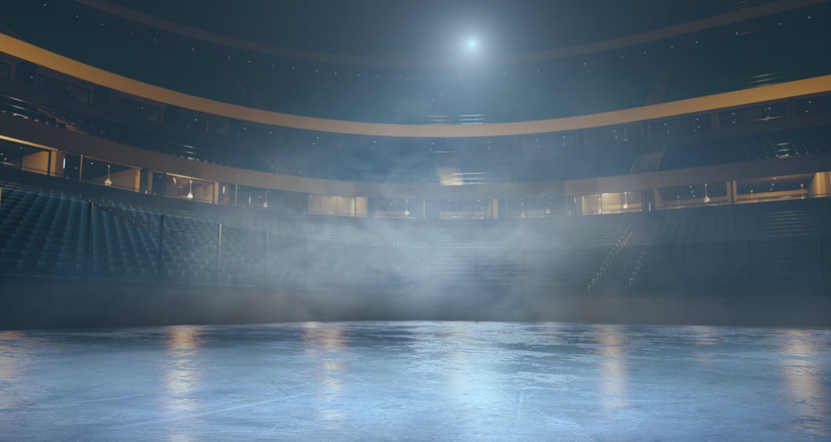 Hockey arena interior with ice rink and seating for sports venue